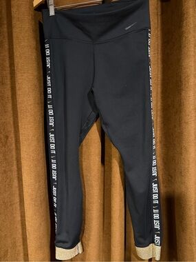 Nike Black Leggings with 'Just Do It' Side Tape and Gold Hem